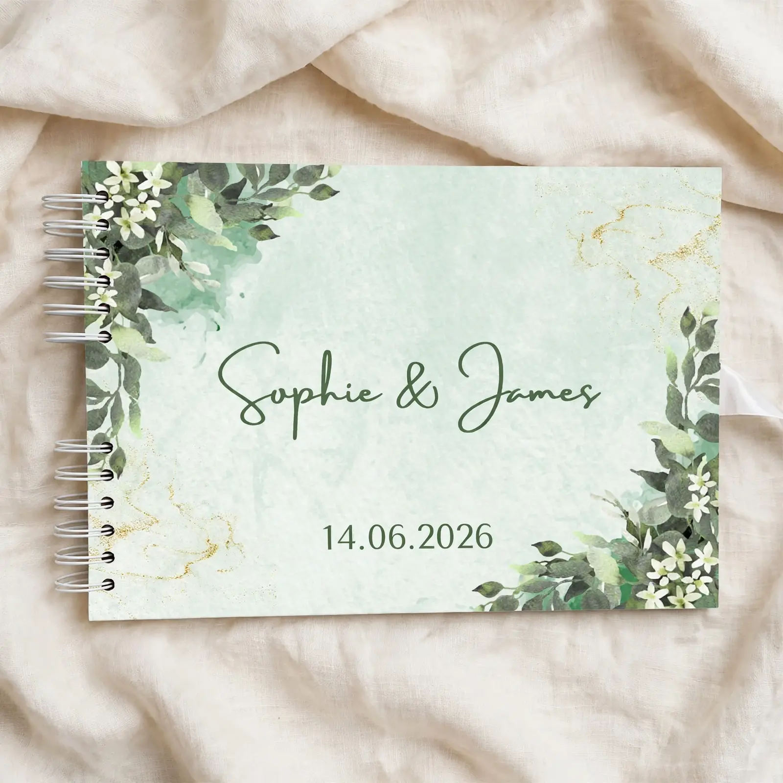 Personalised wedding guestbook with green floral corners, names Sophie & James and the date 14.06.2026