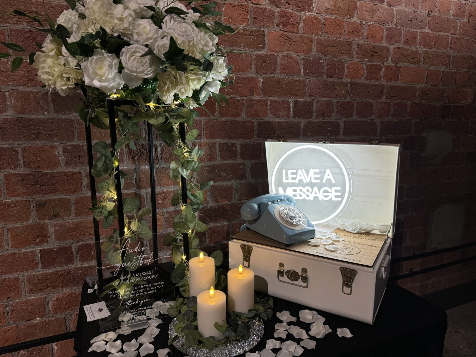 Fully styled Audio Guestbook setup with florals, candles, LED sign and vintage rotary phone — all decor included with manned option