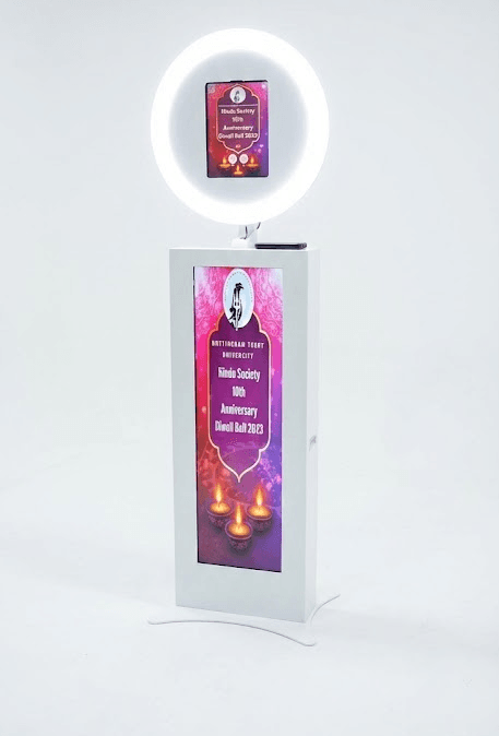 White DJ and photo booth setup for a luxury wedding