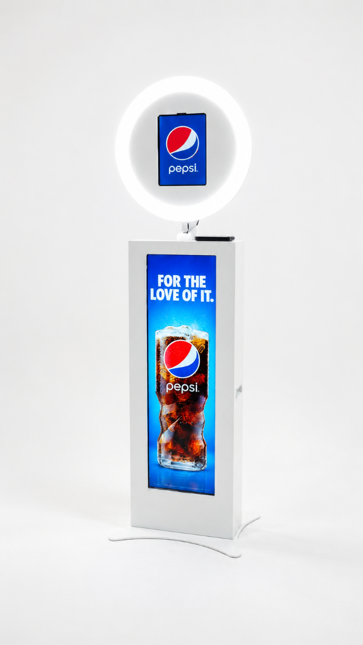 The White Slimline Photo Booth — slim white pillar with custom 30‑inch beauty ring light and LCD screen